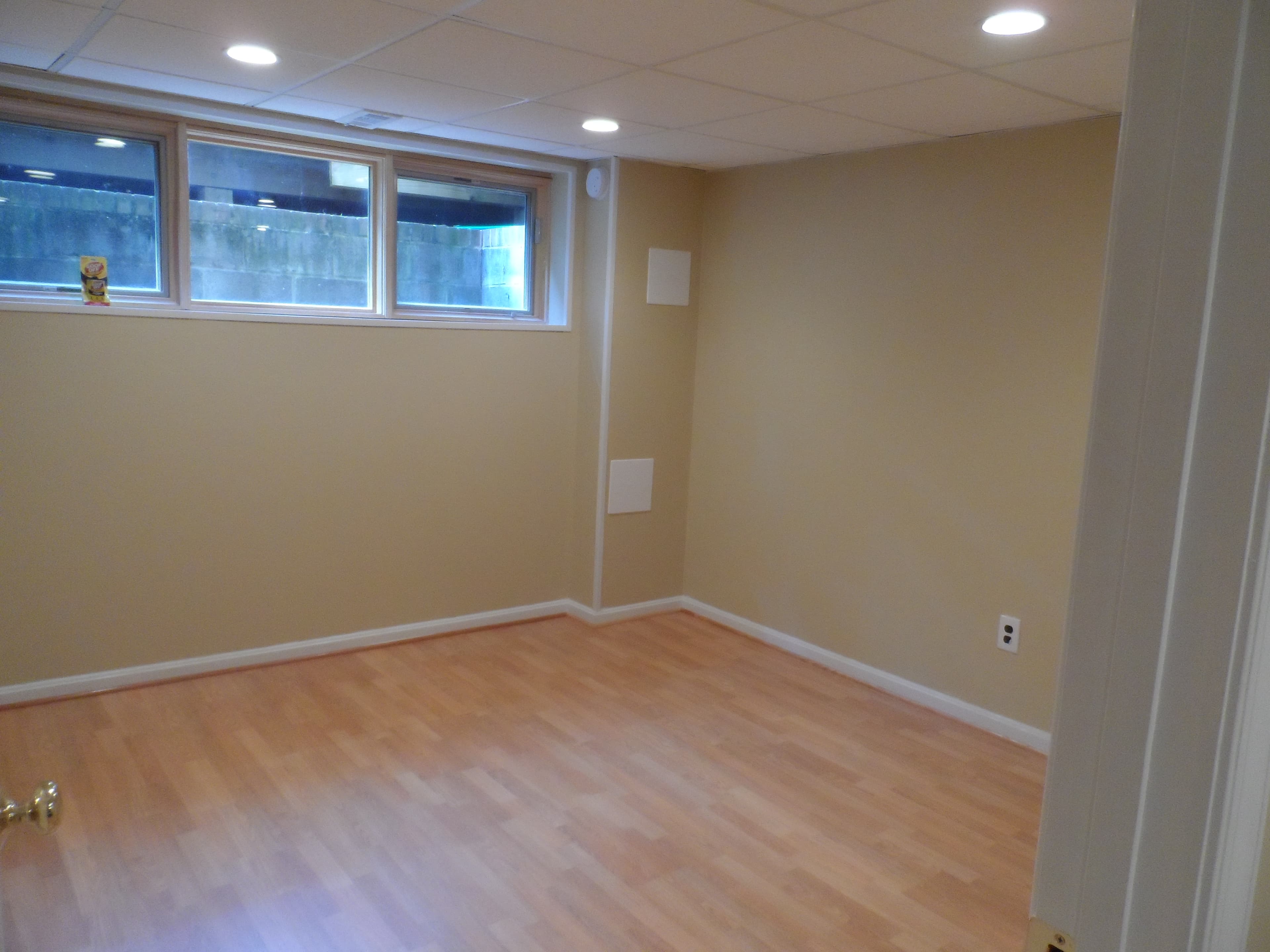 Basement room with kitchen after image 2