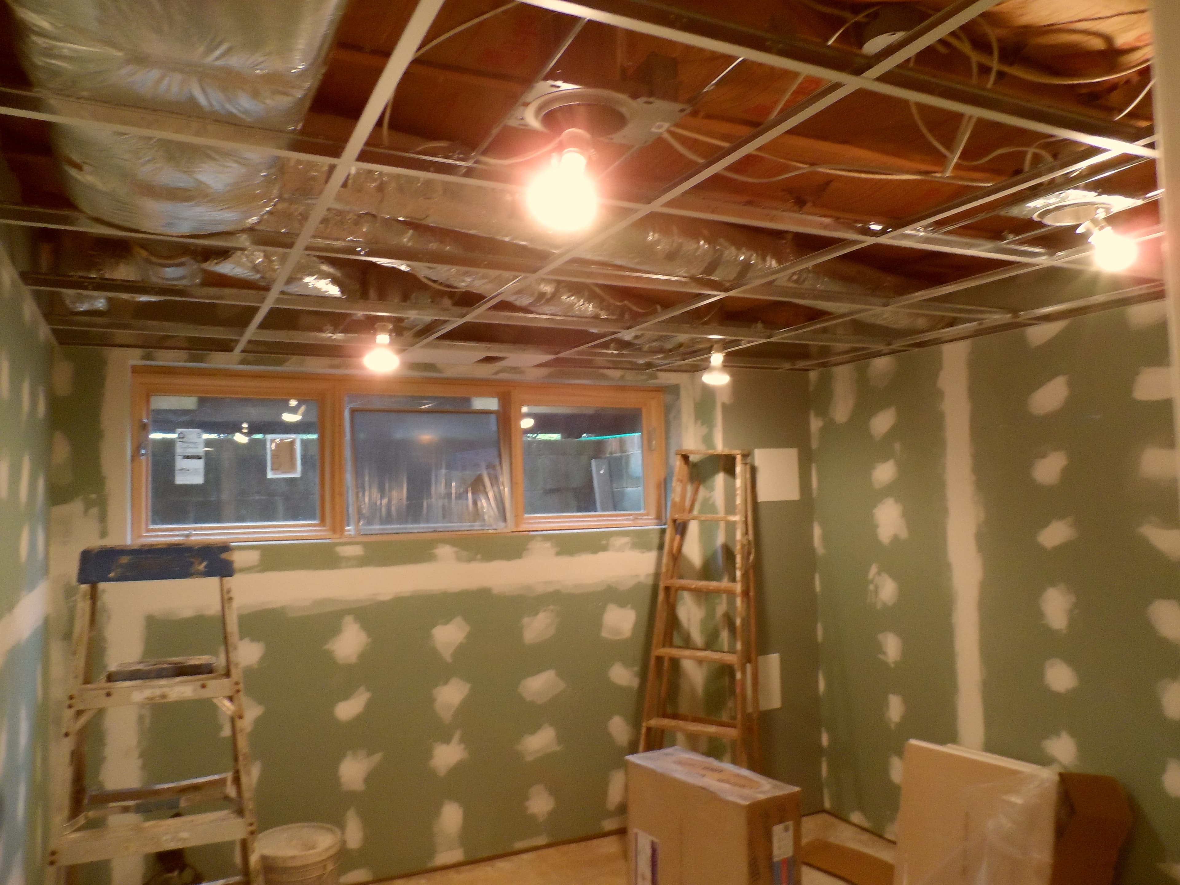 Basement room with kitchen before image 2