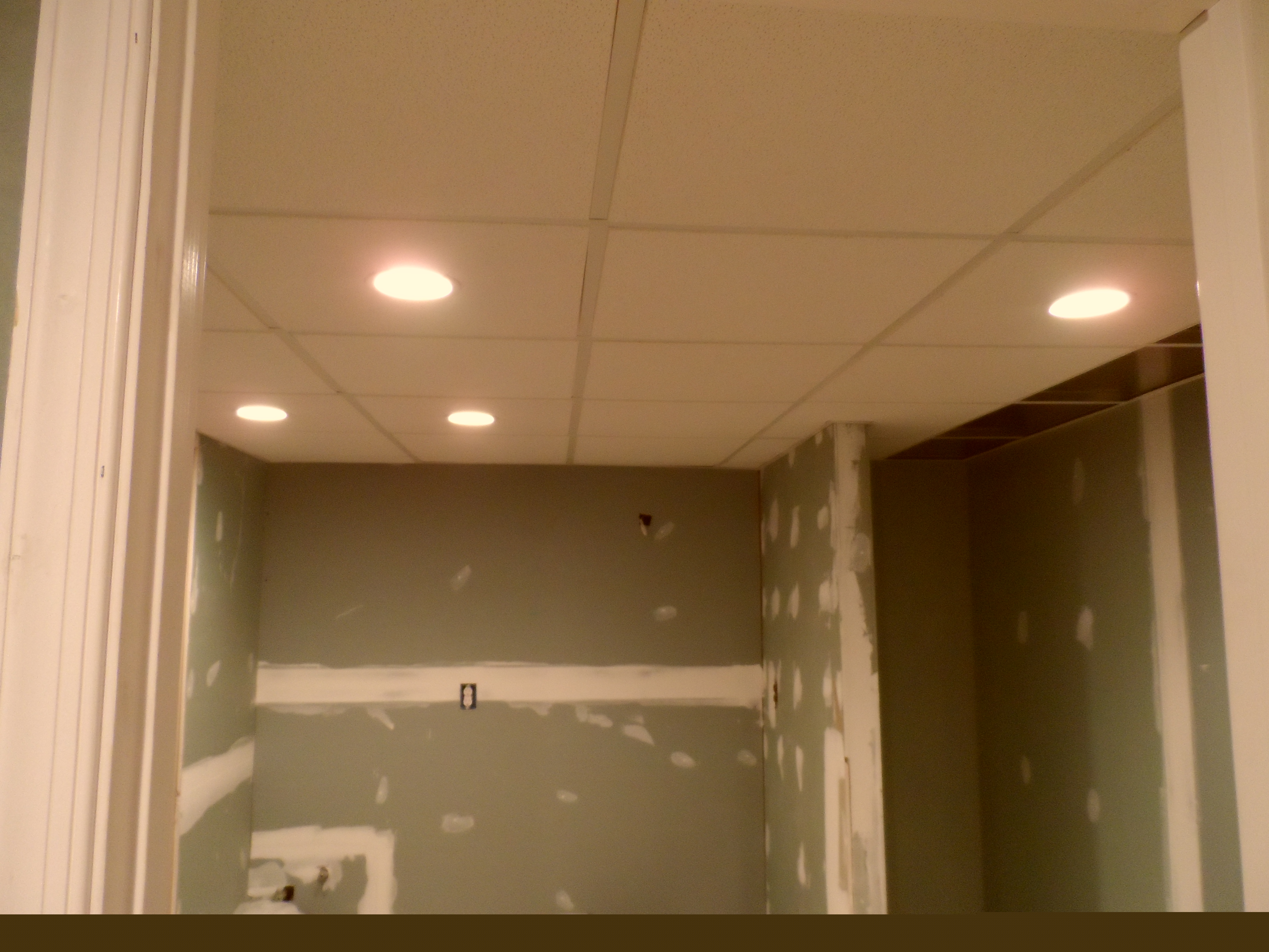 Basement room with kitchen before image 3