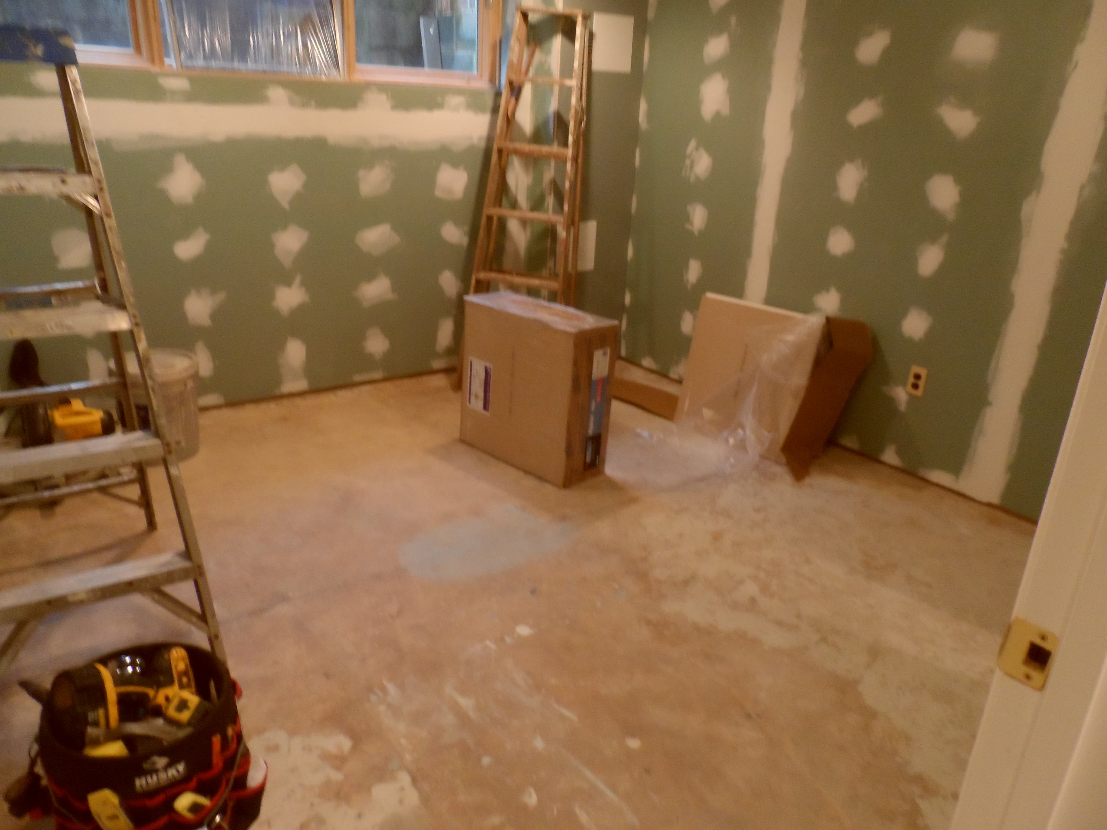 Basement room with kitchen before image 5