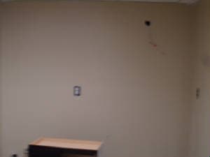 Basement room with kitchen before image 6