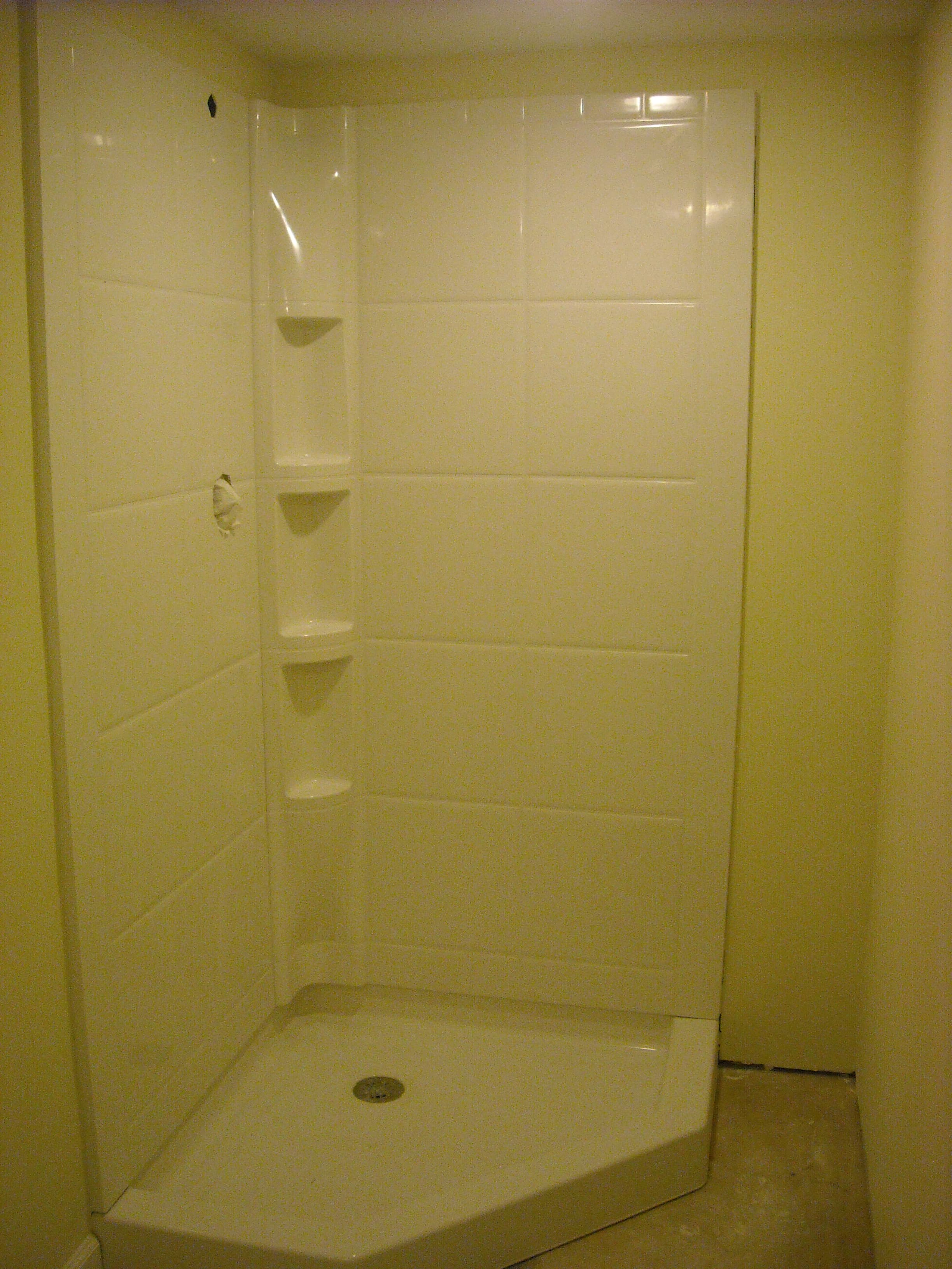 Basement with standing shower after image 1
