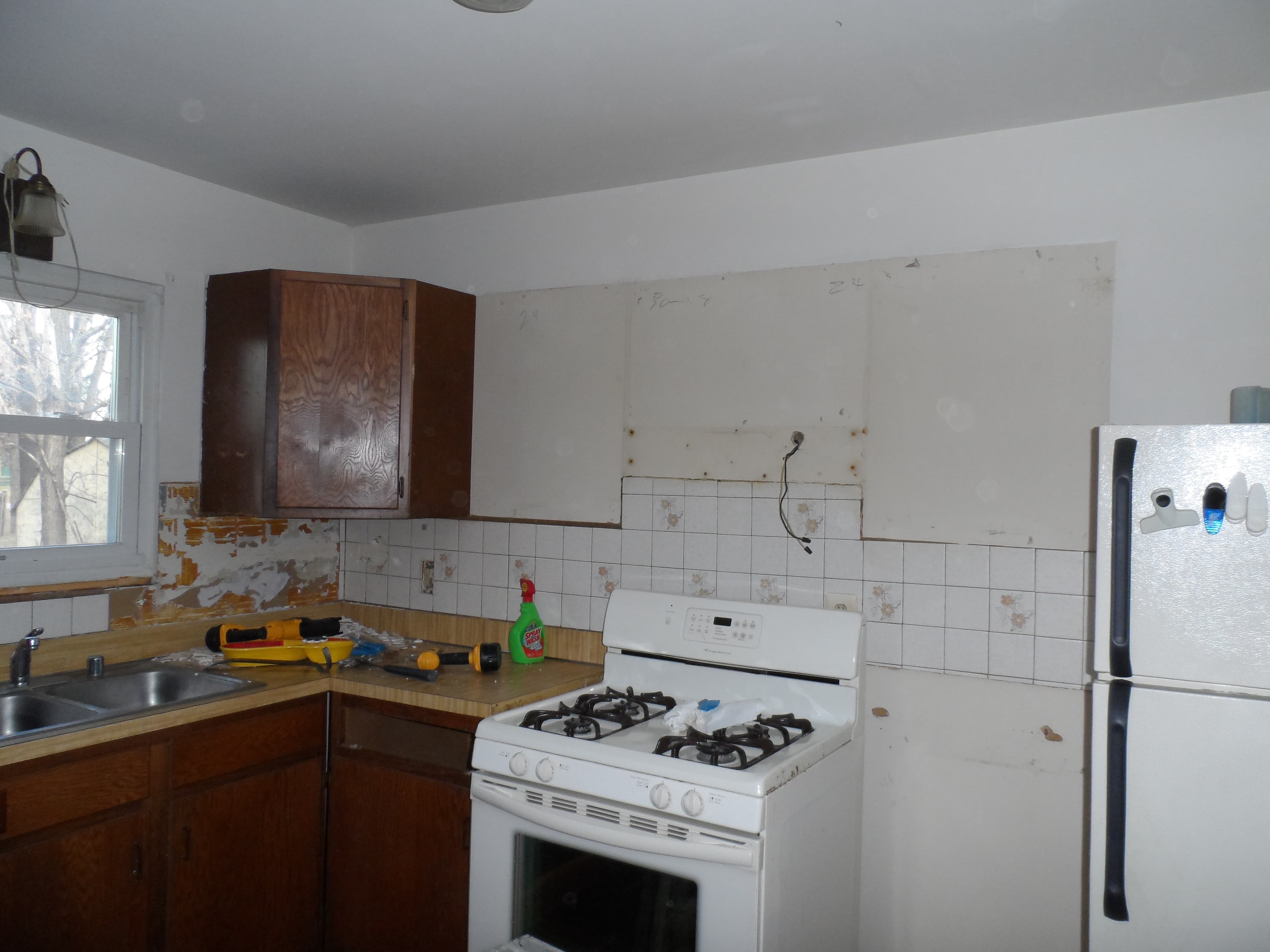 Installation of new kitchen cabinets before image 1